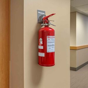 Fire extinguisher installed on an interior wall, highlighting fire protection in public buildings. 